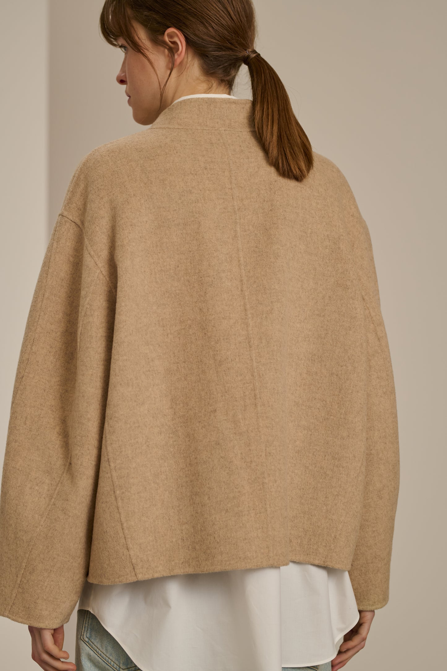 Back view close-up of the beige Soeur Windsor coat