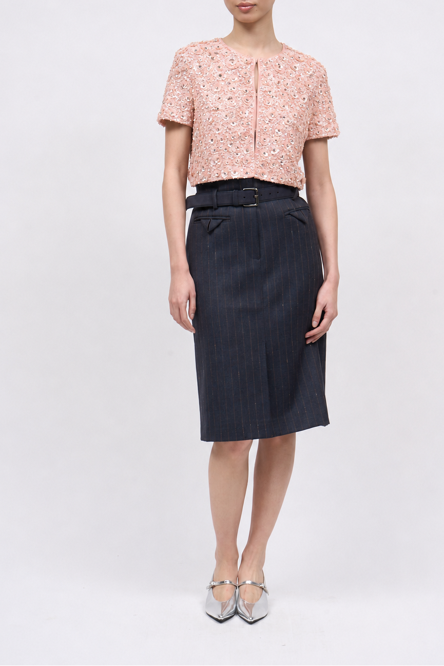 Front view of the Paul & Joe Violetta hand-embroidered short jacket in pink, worn with a navy pinstripe pencil skirt
