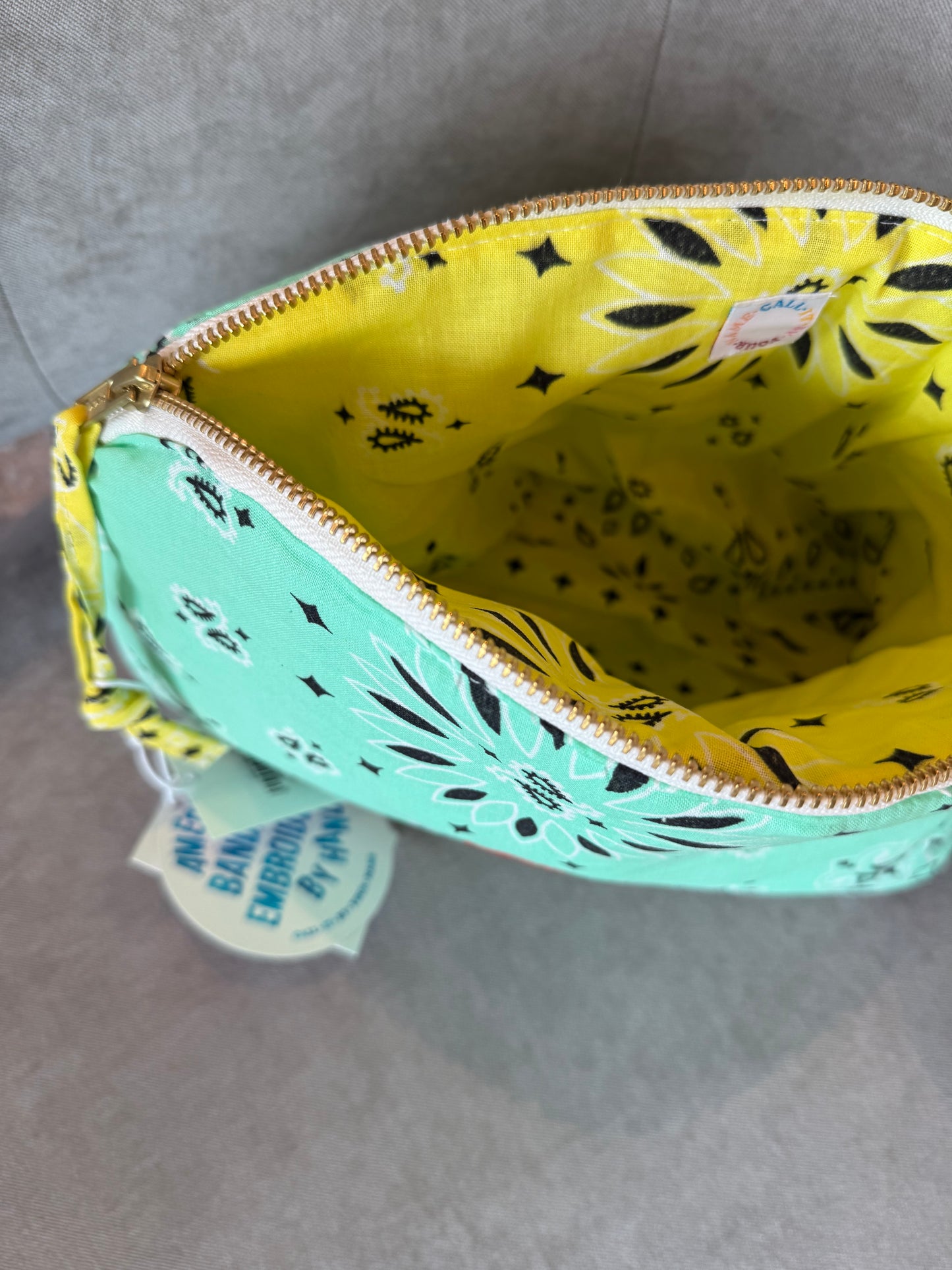 mint teal and yellow bandana toiletry case for makeup by call it by your name with a rainbow embroidery, interior view