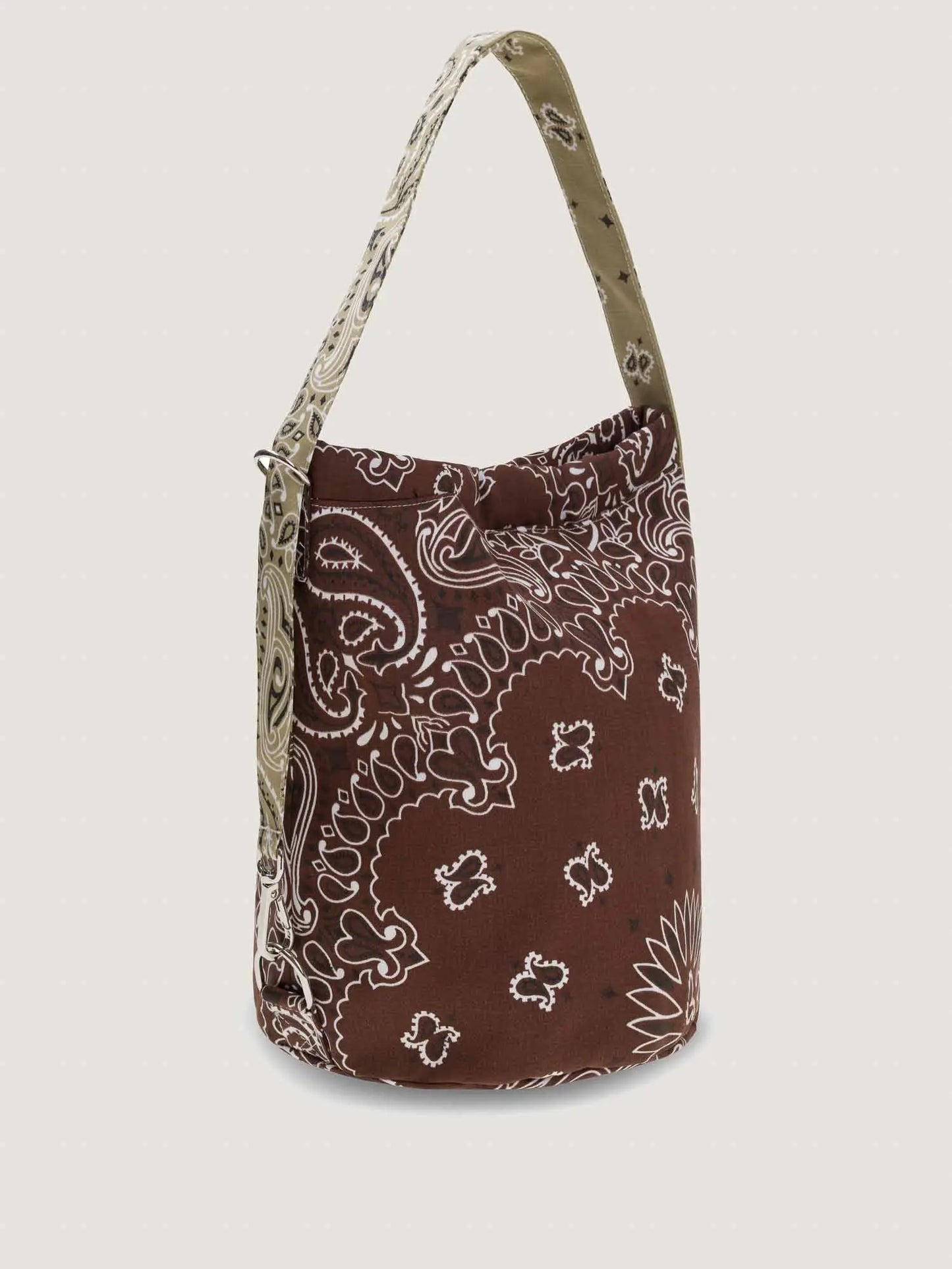 Brown and beige bandana bucket bag with adjustable strap, by brand Call it by your name, side view