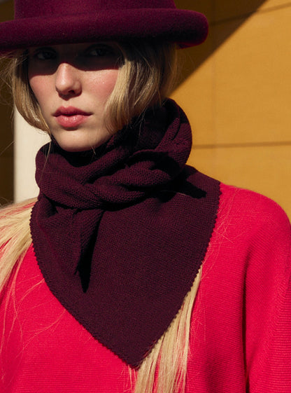 Molli Frais amaranth fine-knit scarf worn by a model, Fall/Winter 2026 campaign