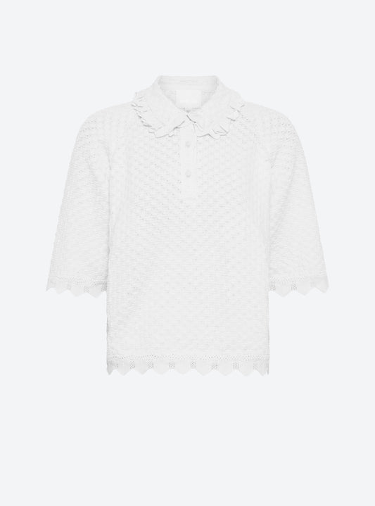 Front view of the Molli Fantaisie couture knit polo top in milk with lace-like trims