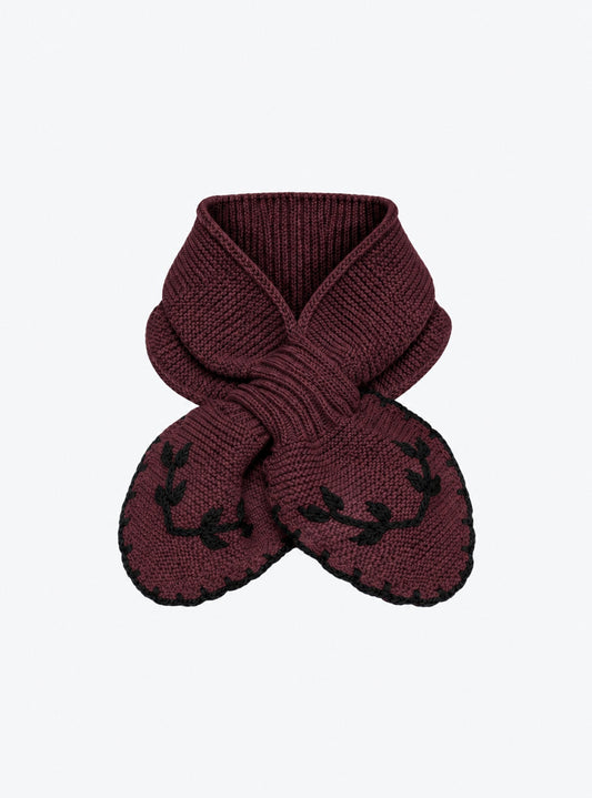 Flat-lay view of the Molli Dolce hand-embroidered mini scarf in amaranth with midnight blue embroidery