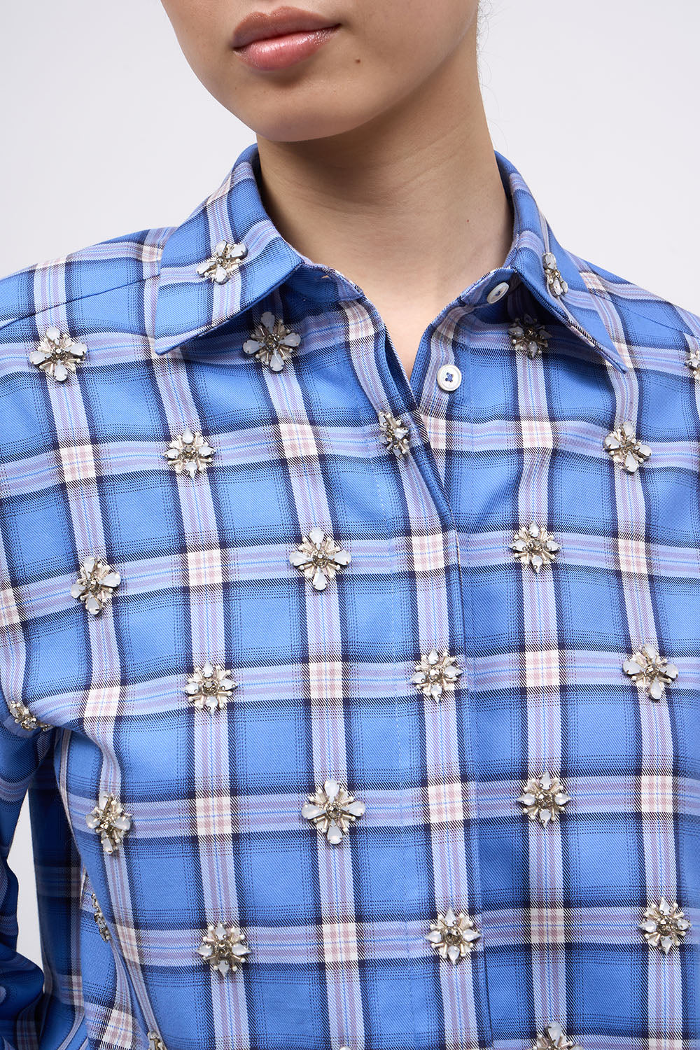 Close-up of the hand-embroidered motifs on the front of the Paul & Joe Carat blue checked shirt