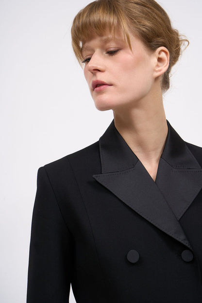 Close-up of the lapels on the Paul & Joe Karmen black wool coat dress