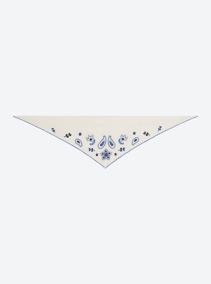 Flat-lay view of the Molli Fantastique natural knit bandana with multicolor and blue embroidery