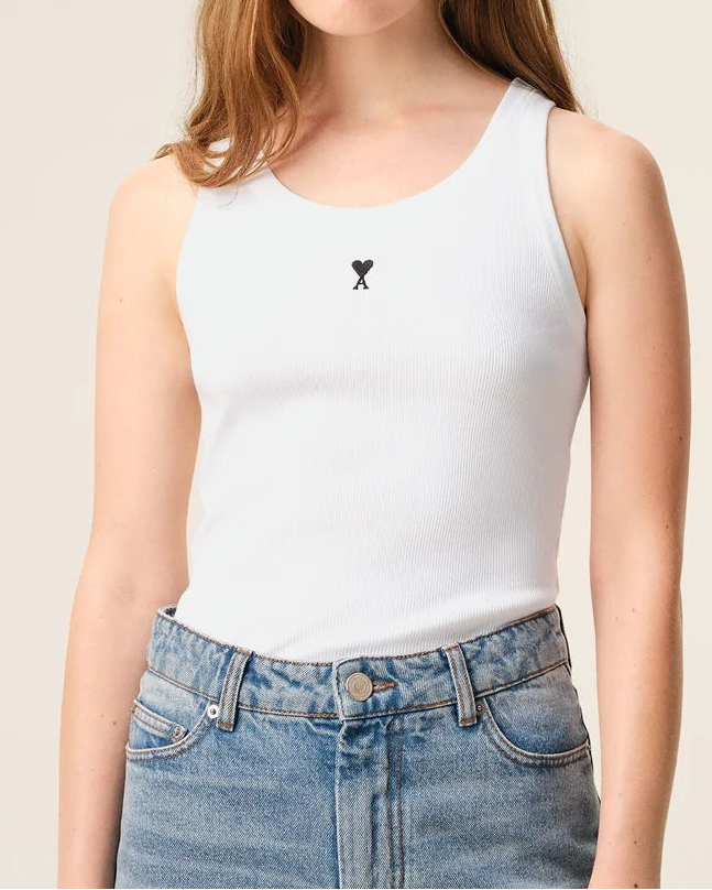 white tank top with an embroidered Ami logo with and A and a heart