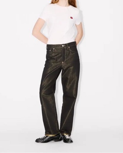 Person wearing a white t-shirt and black lurex japanese denim jeans on a white background