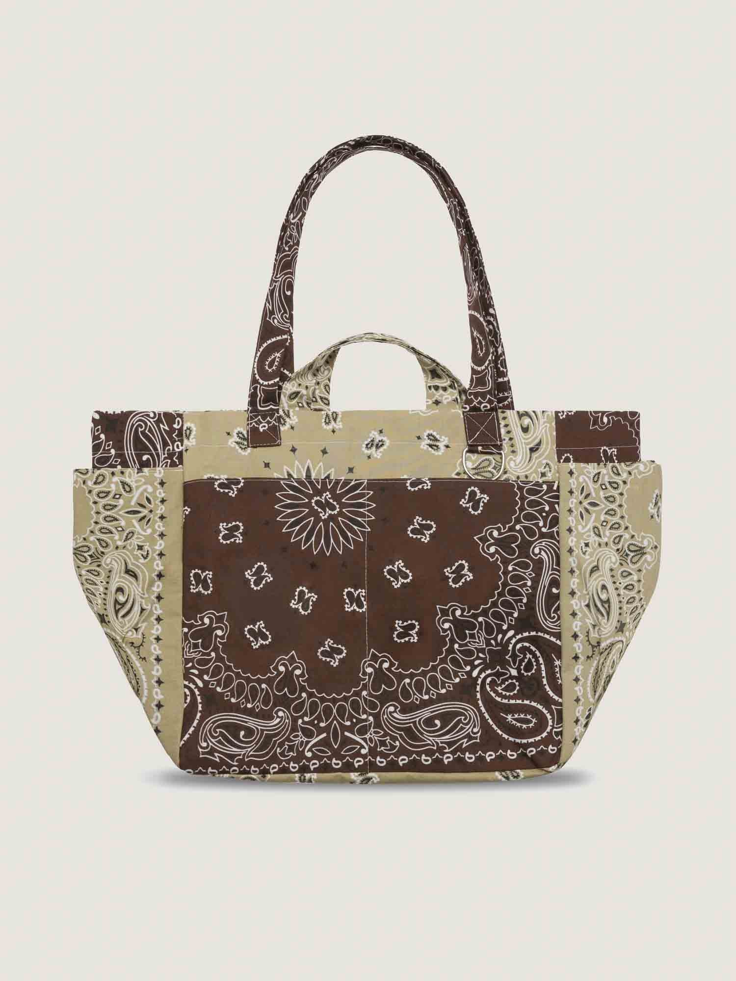 Tote bag with brown bandana pattern on a beige background, with inside and outside pockets, 2 handles and 2 shoulder straps, from brand Call it by your name