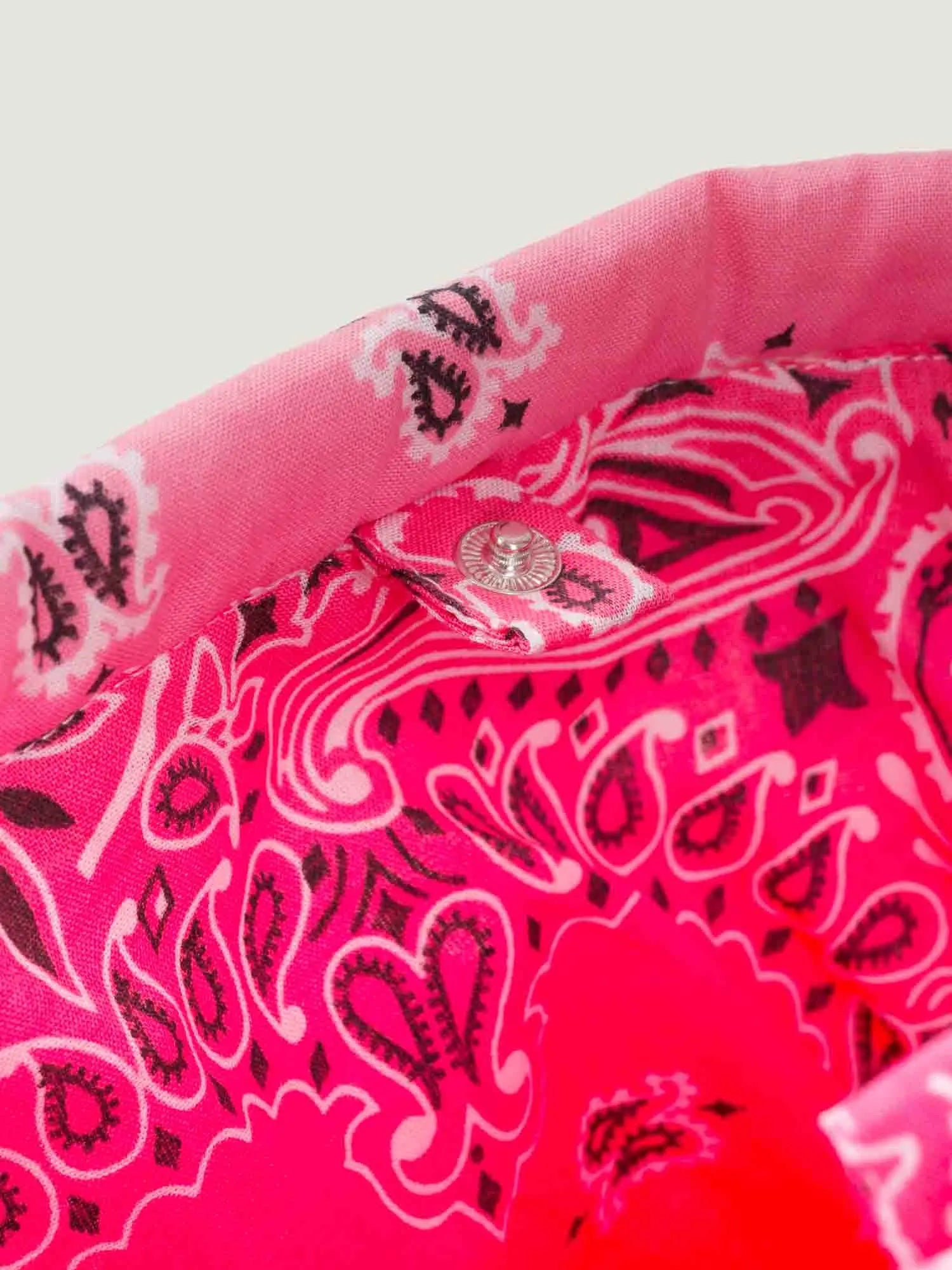 Pink bandana bucket bag with adjustable strap by brand call it by your name, close-up on closure