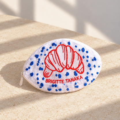 Brigitte Tanaka Paris Croissant pouch in white organza with red croissant embroidery and blue dots, front view