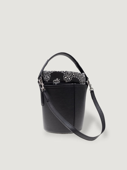 Side view of the Call It By Your Name mini black Peekaboo bag with detachable shoulder strap