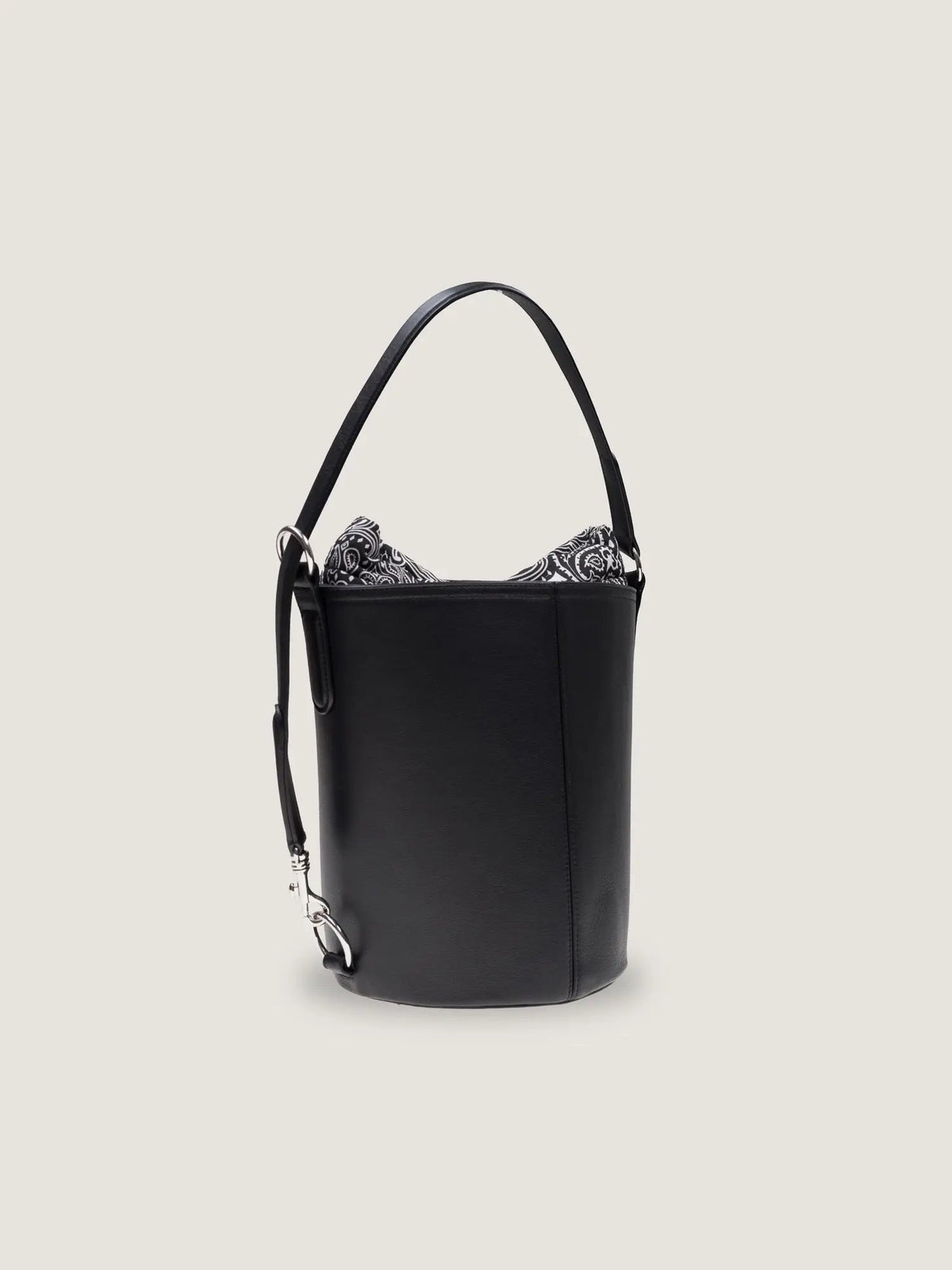 Three-quarter view of the Call It By Your Name medium Peekaboo bag in black leather