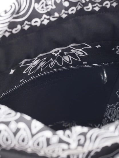 Inside of the Call It By Your Name black Peekaboo bag showing the black bandana-print lining