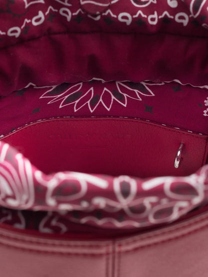 Inside of the Call It By Your Name cherry Peekaboo bag showing the red bandana-print lining