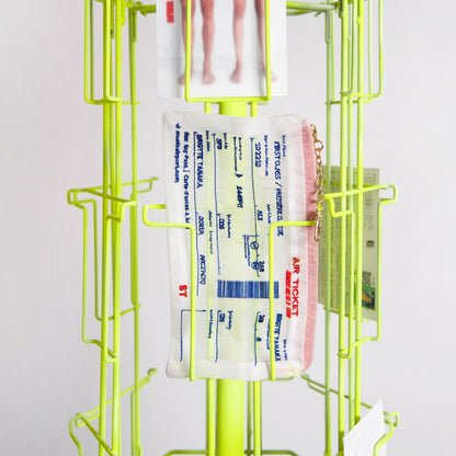 Brigitte Tanaka Air Ticket pouches displayed on a rack