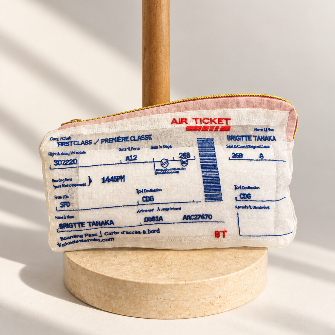 Brigitte Tanaka Air Ticket key holder pouch in white organza with a blue and red airline ticket design