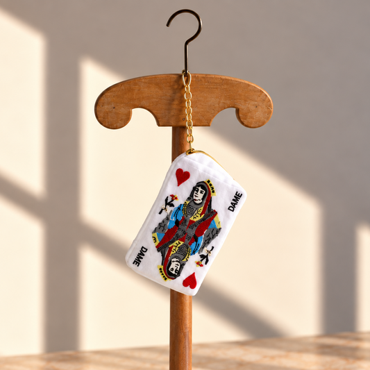 Brigitte Tanaka playing card mini pouch in white organza with a queen card embroidery, on a wooden hanger
