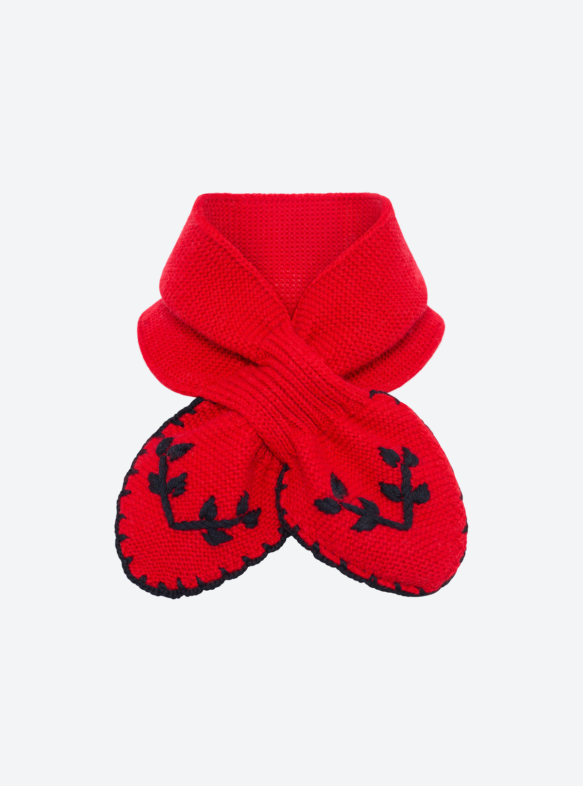 Flat-lay view of the Molli Dolce hand-embroidered mini scarf in lady red with deep black leaf embroidery and blanket-stitch edging