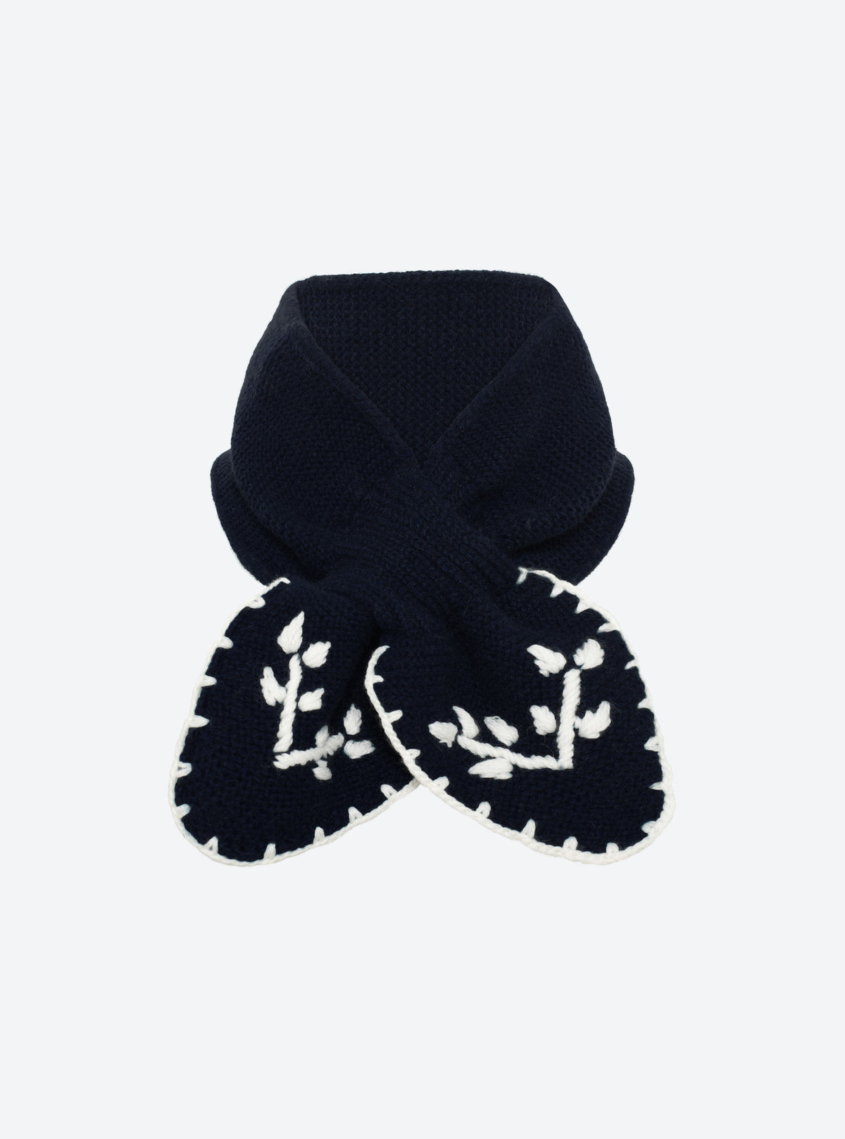 Flat-lay view of the Molli Dolce hand-embroidered mini scarf in midnight blue with natural embroidery