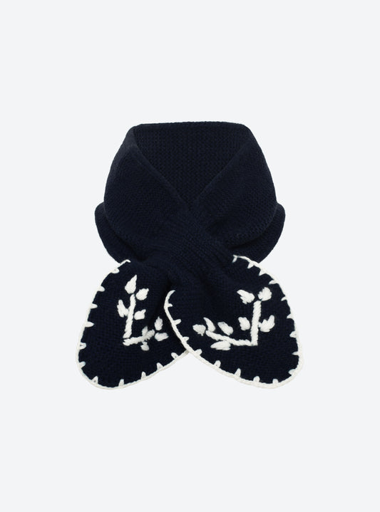 Flat-lay view of the Molli Dolce hand-embroidered mini scarf in midnight blue with natural embroidery