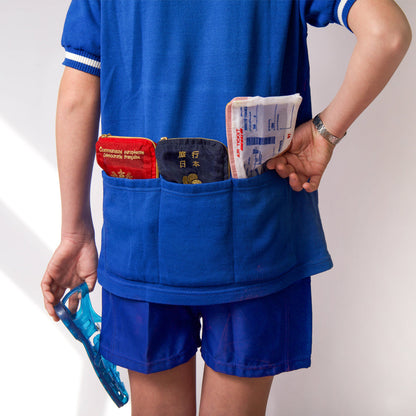 Model in blue wearing the Brigitte Tanaka Air Ticket pouch at the waist