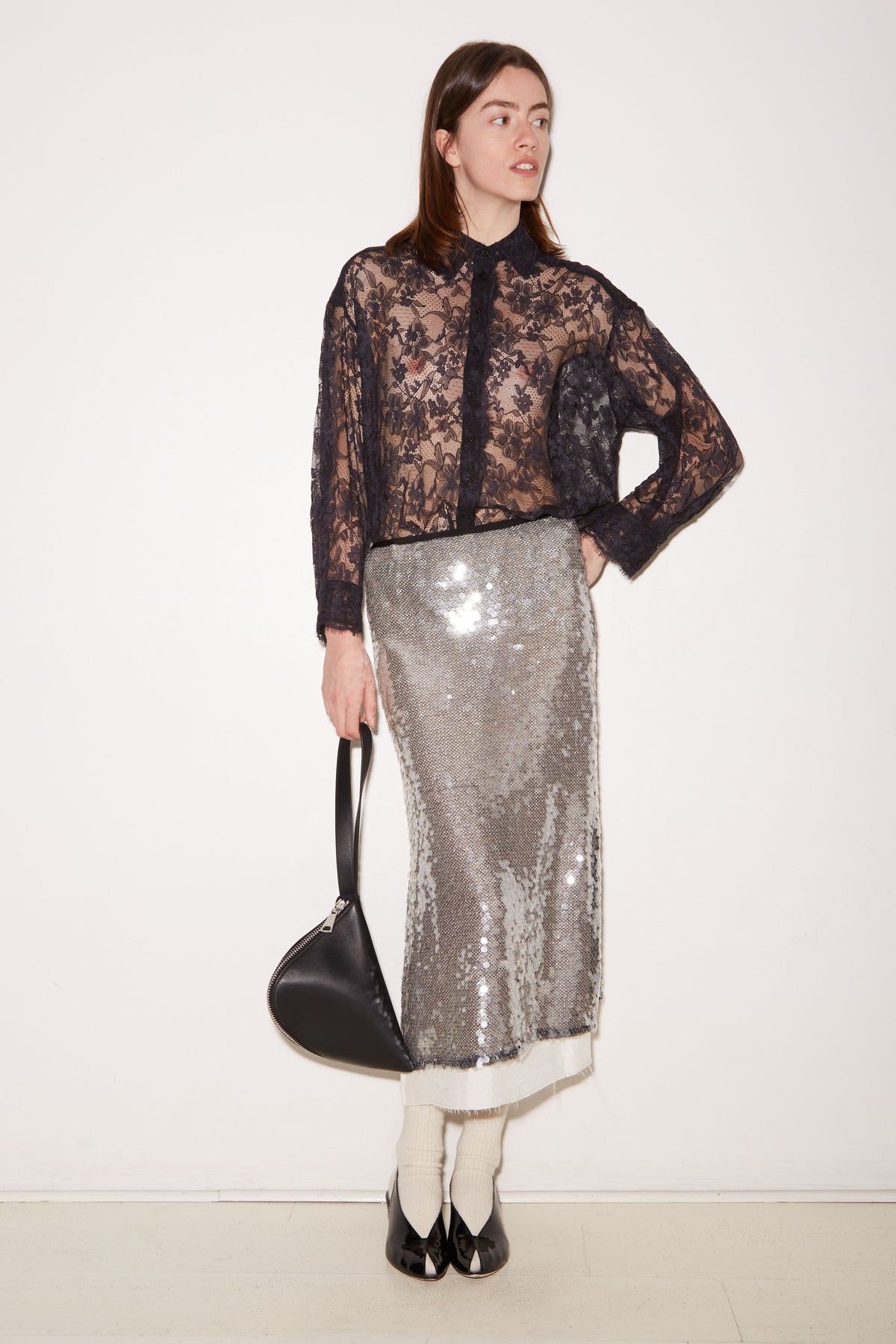 Roseanna Tish navy lace shirt styled with a silver sequin skirt, full-length view