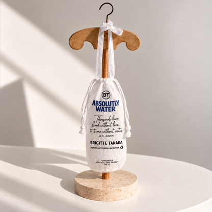 Brigitte Tanaka Absolute Water bottle bag in white organza on a wooden hanger