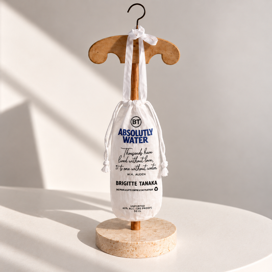 Brigitte Tanaka Absolute Water bottle bag in white organza on a wooden hanger