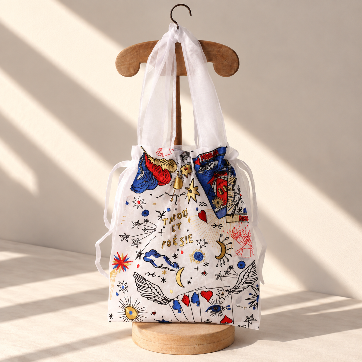 Back of the Brigitte Tanaka x Moulin Rouge white tarot tote with colorful embroidery